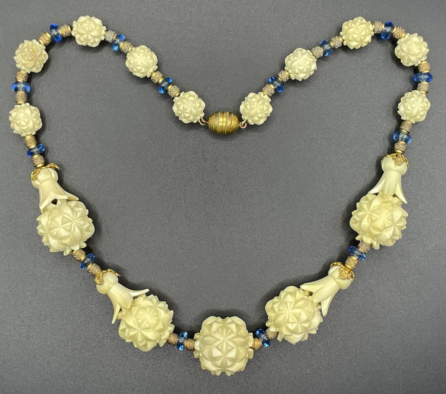 Vintage Louis Rousselet Art Deco carved cream galalith large bead necklace, beehive clasp marked 'Made in France', foxtail chain, blue glass