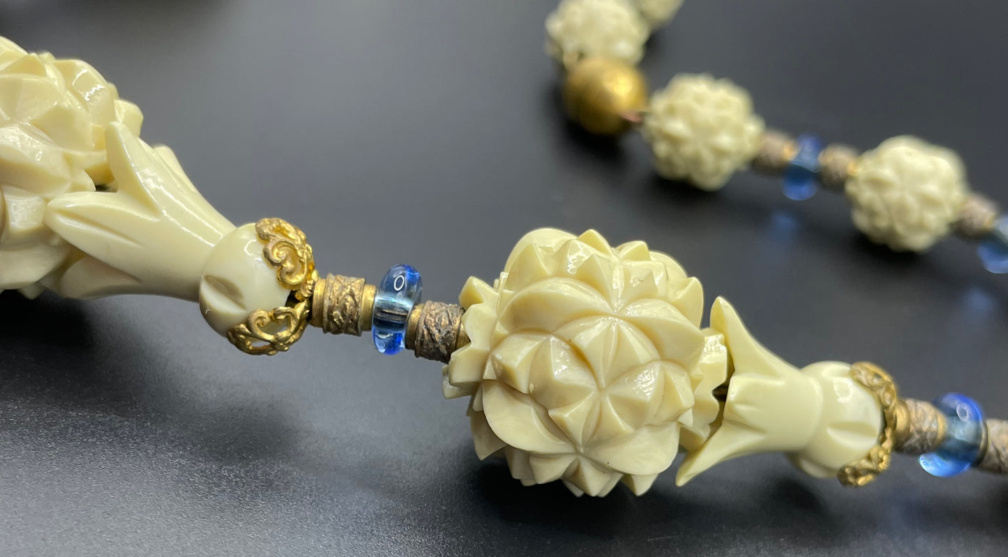 Vintage Louis Rousselet Art Deco carved cream galalith large bead necklace, beehive clasp marked 'Made in France', foxtail chain, blue glass