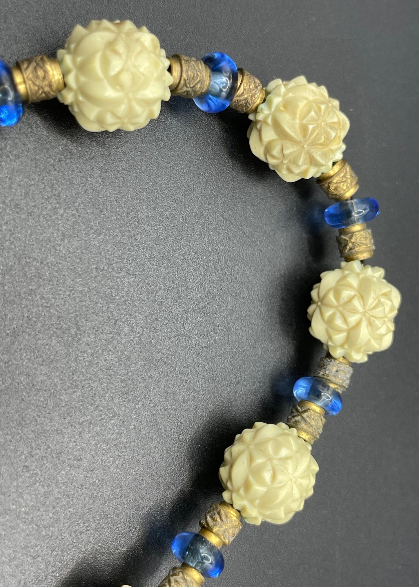 Vintage Louis Rousselet Art Deco carved cream galalith large bead necklace, beehive clasp marked 'Made in France', foxtail chain, blue glass