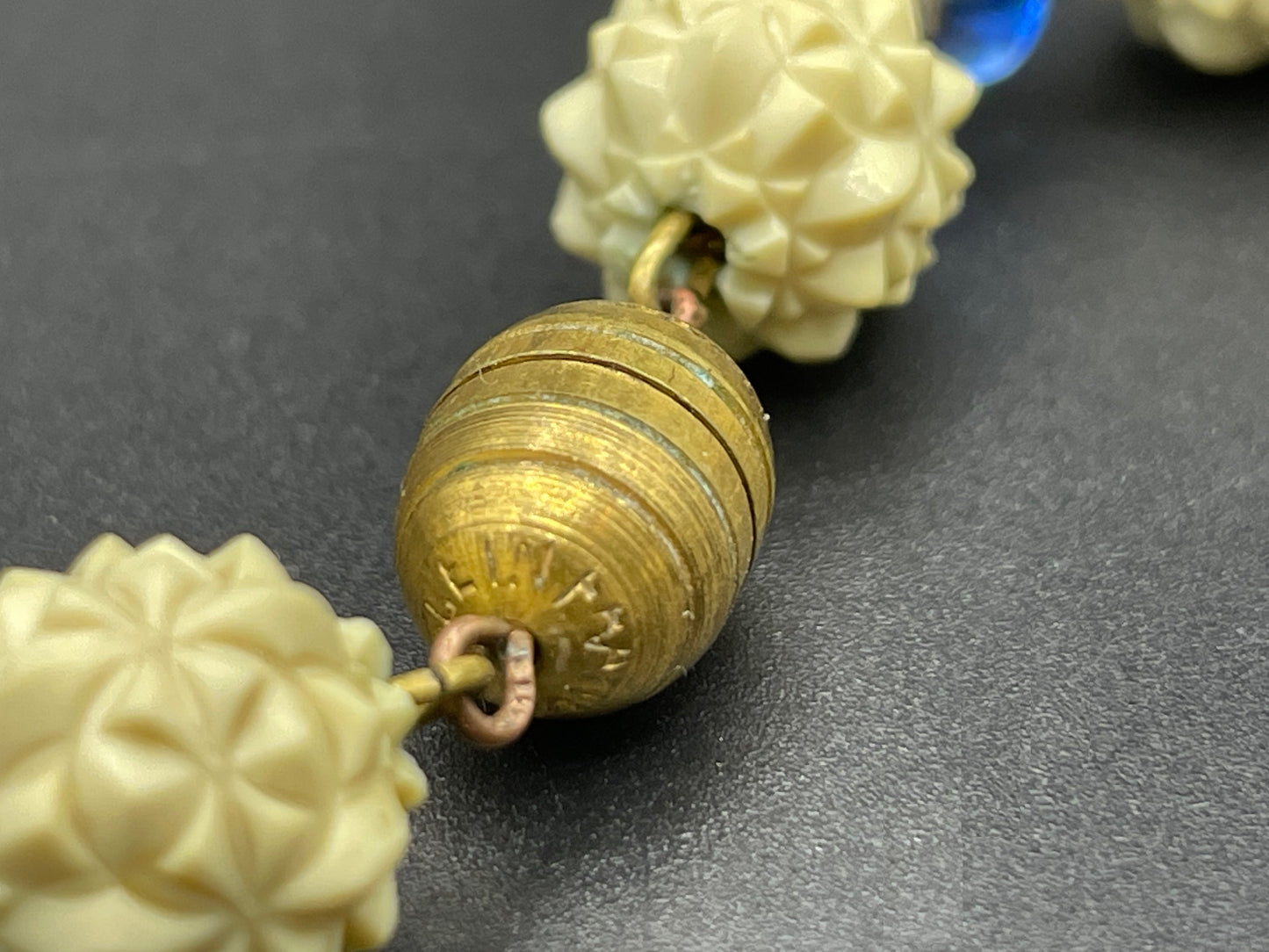 Vintage Louis Rousselet Art Deco carved cream galalith large bead necklace, beehive clasp marked 'Made in France', foxtail chain, blue glass