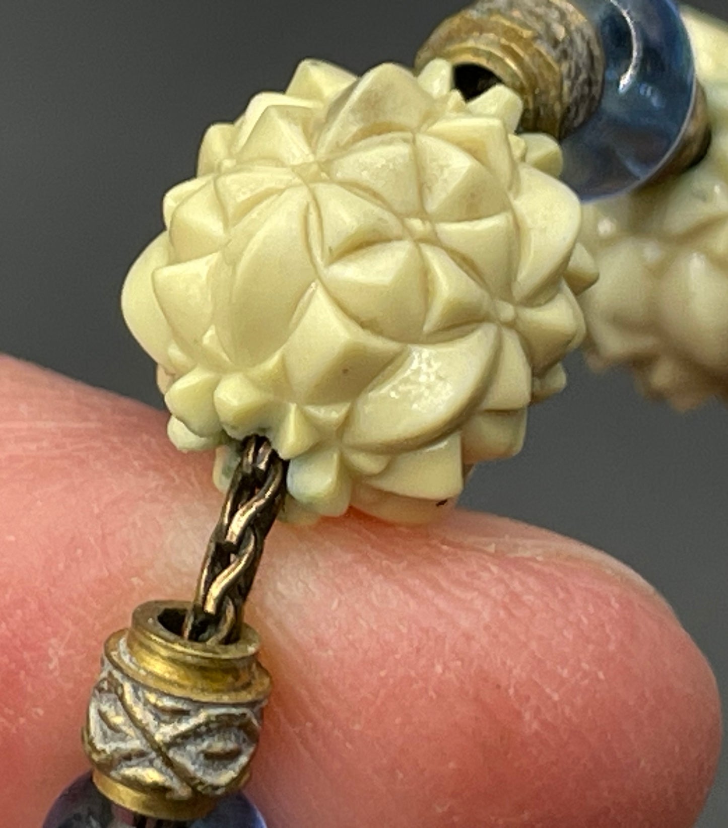 Vintage Louis Rousselet Art Deco carved cream galalith large bead necklace, beehive clasp marked 'Made in France', foxtail chain, blue glass