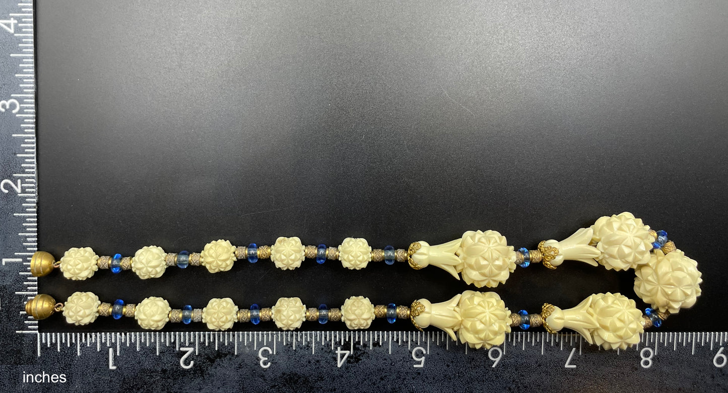 Vintage Louis Rousselet Art Deco carved cream galalith large bead necklace, beehive clasp marked 'Made in France', foxtail chain, blue glass