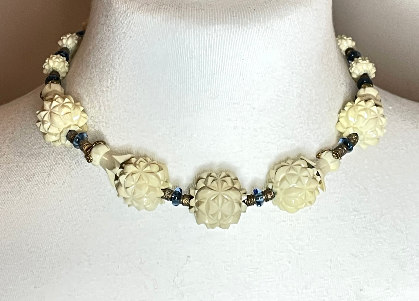 Vintage Louis Rousselet Art Deco carved cream galalith large bead necklace, beehive clasp marked 'Made in France', foxtail chain, blue glass