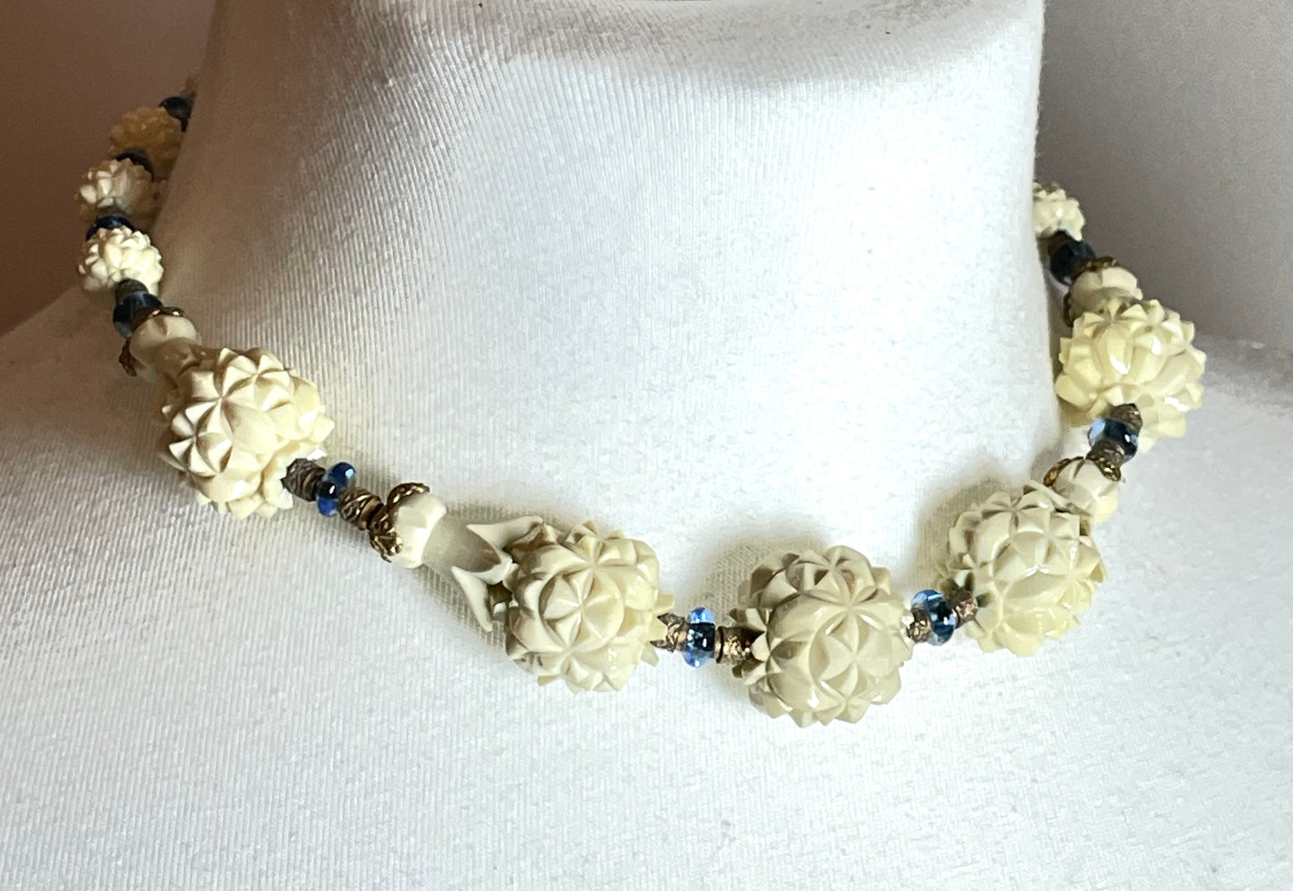Vintage Louis Rousselet Art Deco carved cream galalith large bead necklace, beehive clasp marked 'Made in France', foxtail chain, blue glass