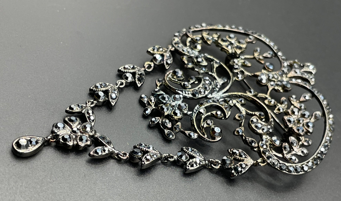 Large vintage Butler and Wilson (B&W) signed blackened silver tone and black French jet rhinestone ornate festoon 'stomacher' brooch