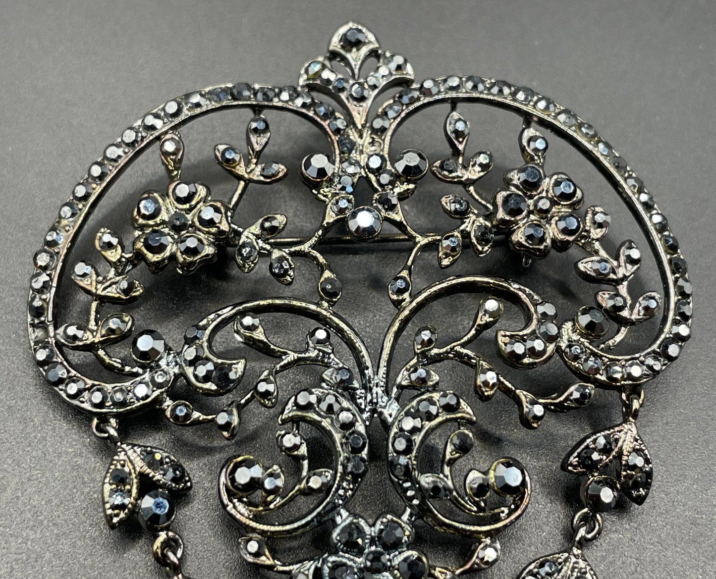 Large vintage Butler and Wilson (B&W) signed blackened silver tone and black French jet rhinestone ornate festoon 'stomacher' brooch