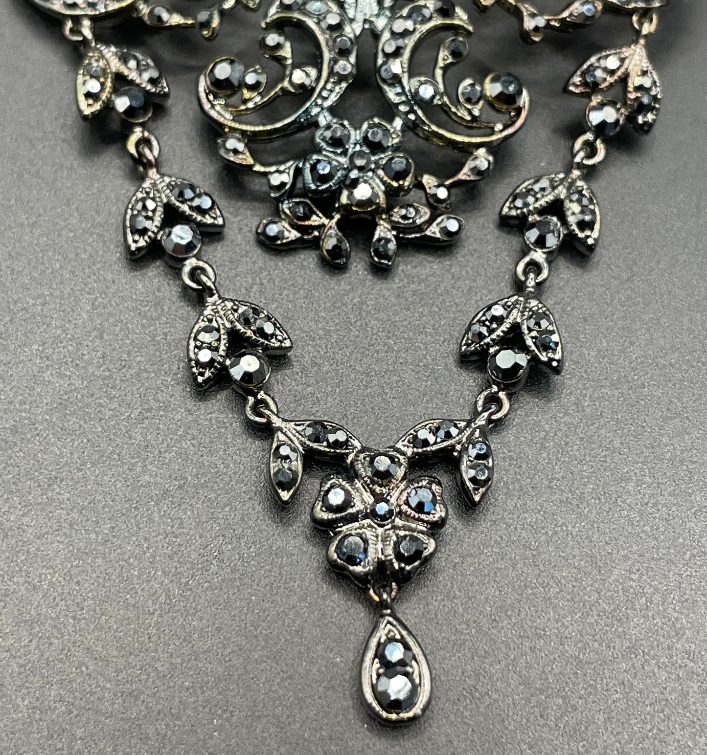 Large vintage Butler and Wilson (B&W) signed blackened silver tone and black French jet rhinestone ornate festoon 'stomacher' brooch