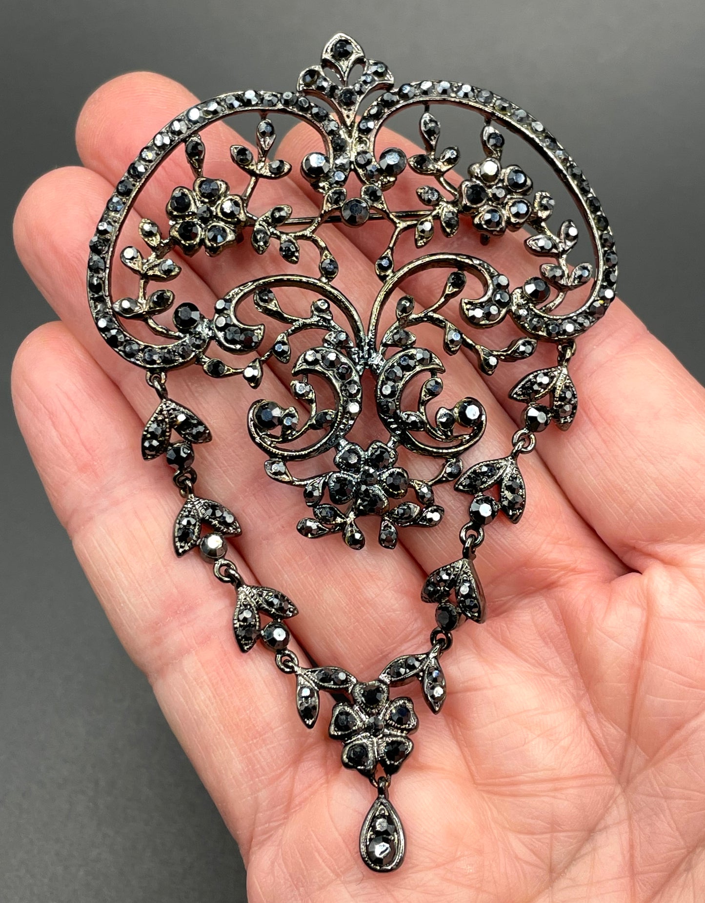 Large vintage Butler and Wilson (B&W) signed blackened silver tone and black French jet rhinestone ornate festoon 'stomacher' brooch