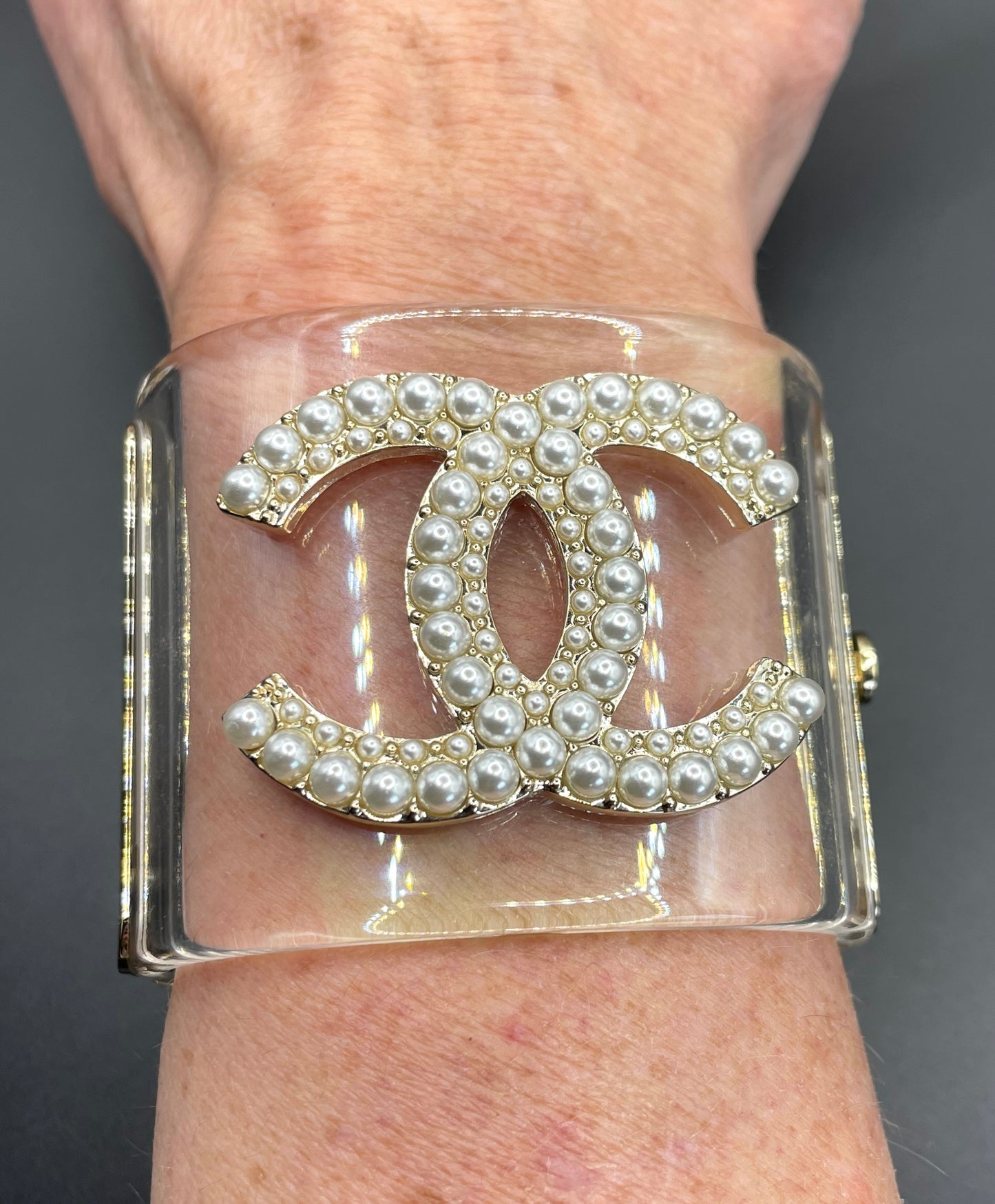 Vintage Chanel CC logo cuff bangle with clear perspex, faux pearl and gold tone, 2018 design