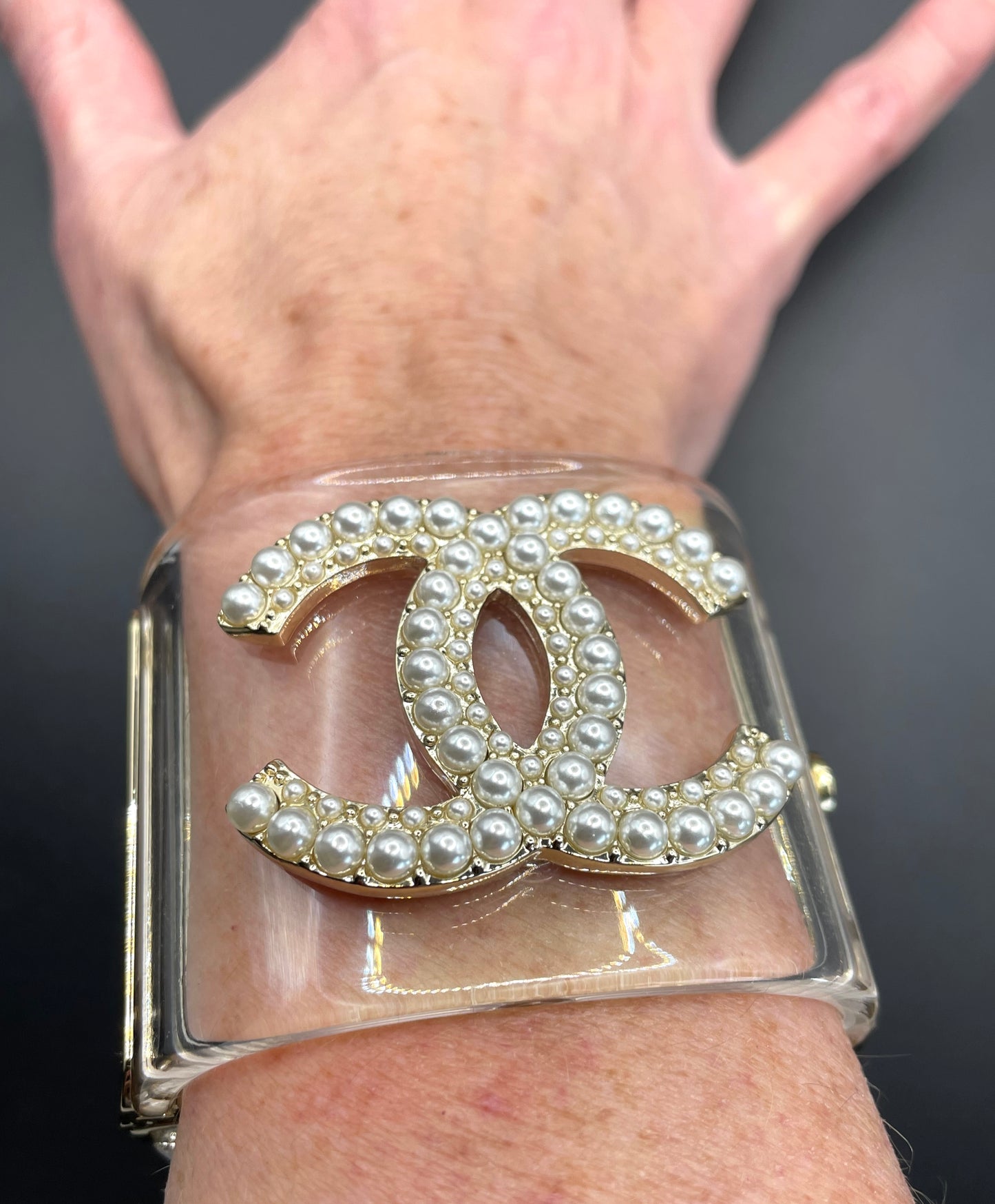 Vintage Chanel CC logo cuff bangle with clear perspex, faux pearl and gold tone, 2018 design