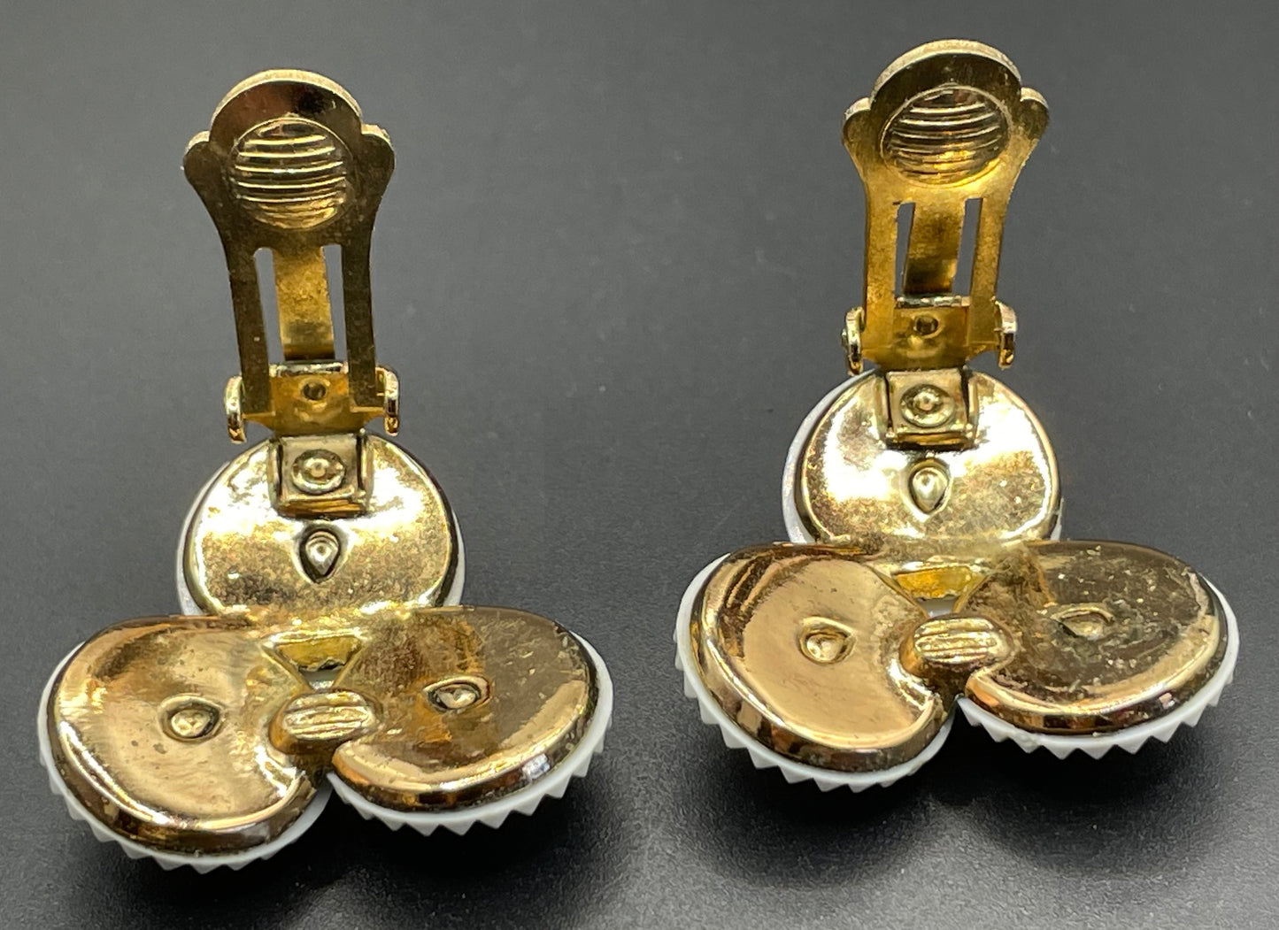 Vintage signed Trifari white celluloid plastic, clear rhinestone and gold tone panel bracelet and clip on earrings set, 1960s