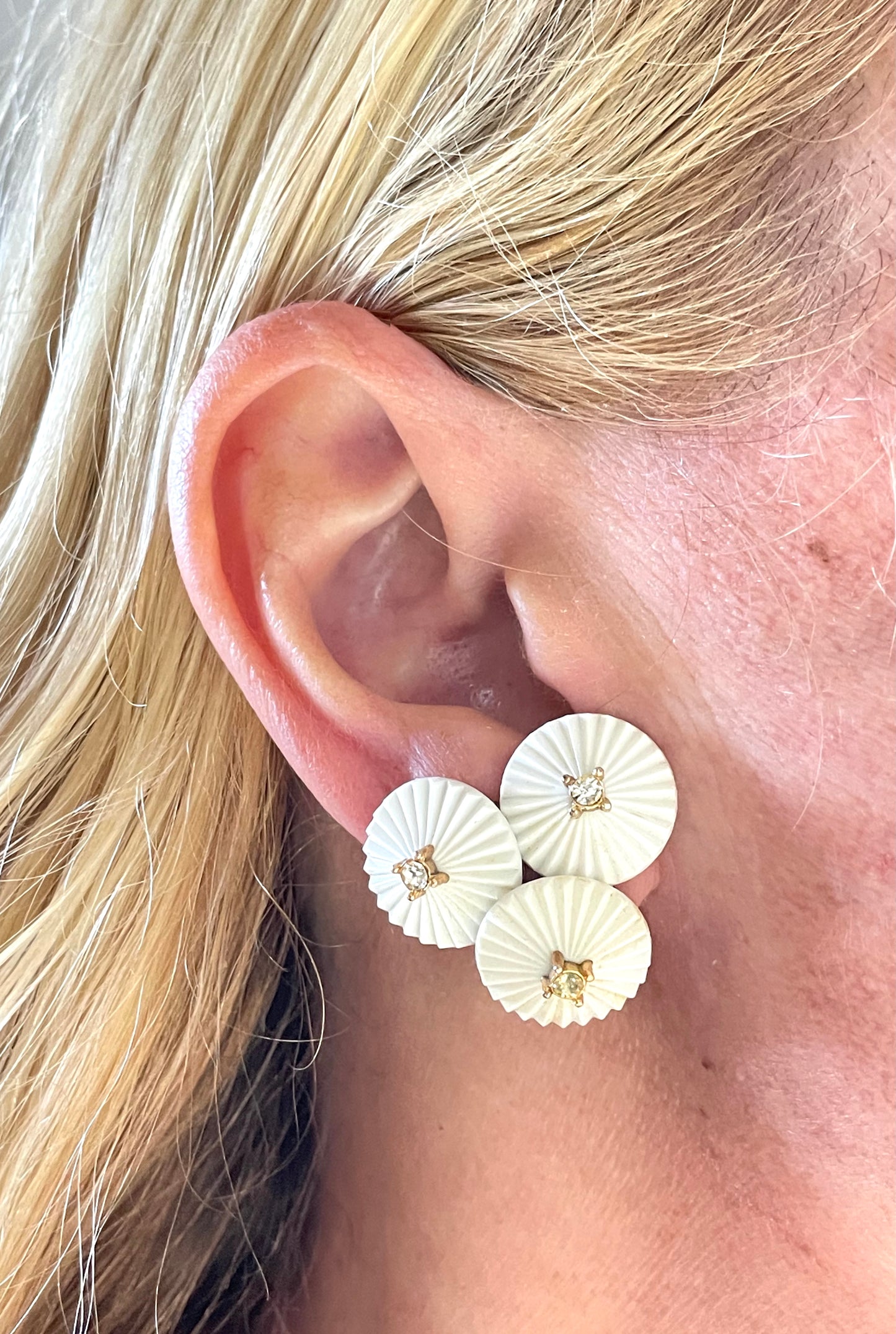 Vintage signed Trifari white celluloid plastic, clear rhinestone and gold tone panel bracelet and clip on earrings set, 1960s