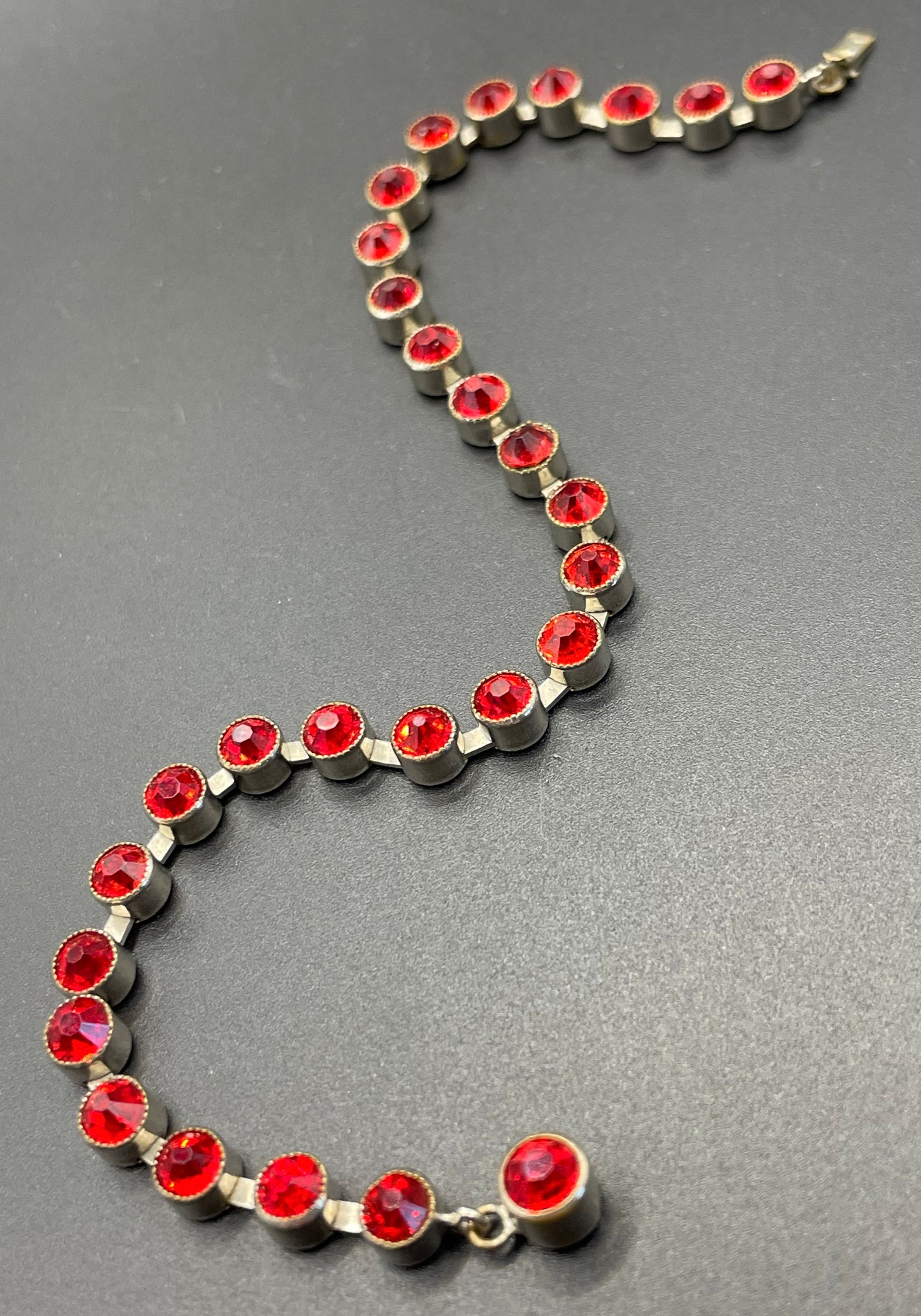 Vintage 1930s Art Deco collet set bright ruby red rhinestone and silver tone tennis / cocktail bracelet