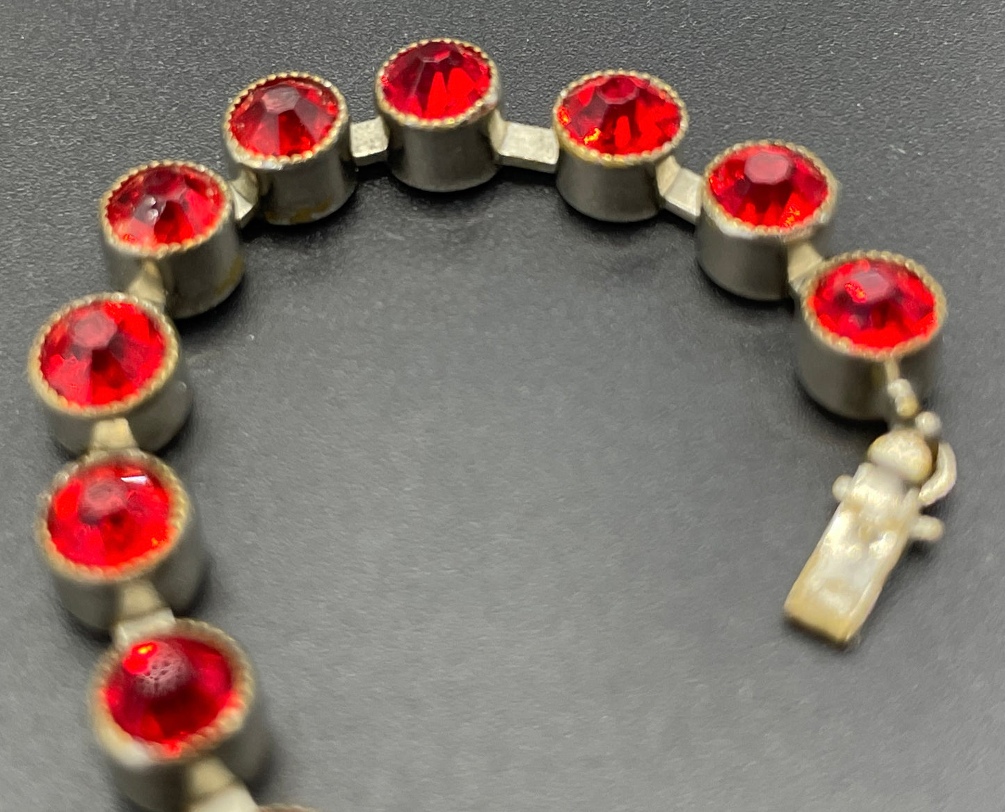 Vintage 1930s Art Deco collet set bright ruby red rhinestone and silver tone tennis / cocktail bracelet