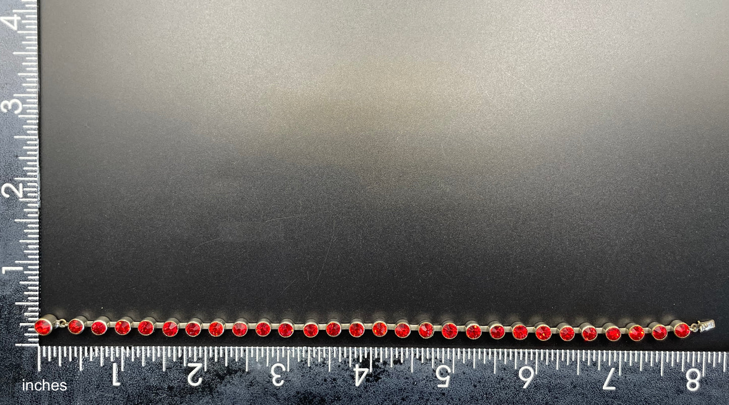 Vintage 1930s Art Deco collet set bright ruby red rhinestone and silver tone tennis / cocktail bracelet