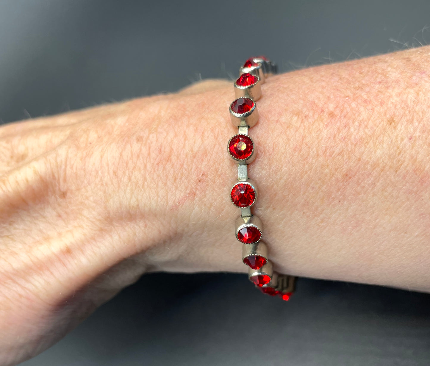 Vintage 1930s Art Deco collet set bright ruby red rhinestone and silver tone tennis / cocktail bracelet