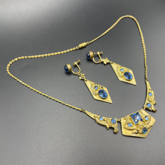 Vintage Neiger brothers sapphire blue rhinestone ornate Art Deco necklace and screw back earrings set in gold tone