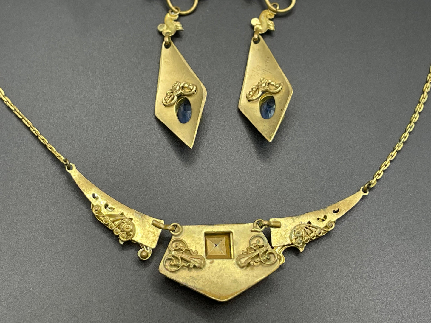 Vintage Neiger brothers sapphire blue rhinestone ornate Art Deco necklace and screw back earrings set in gold tone