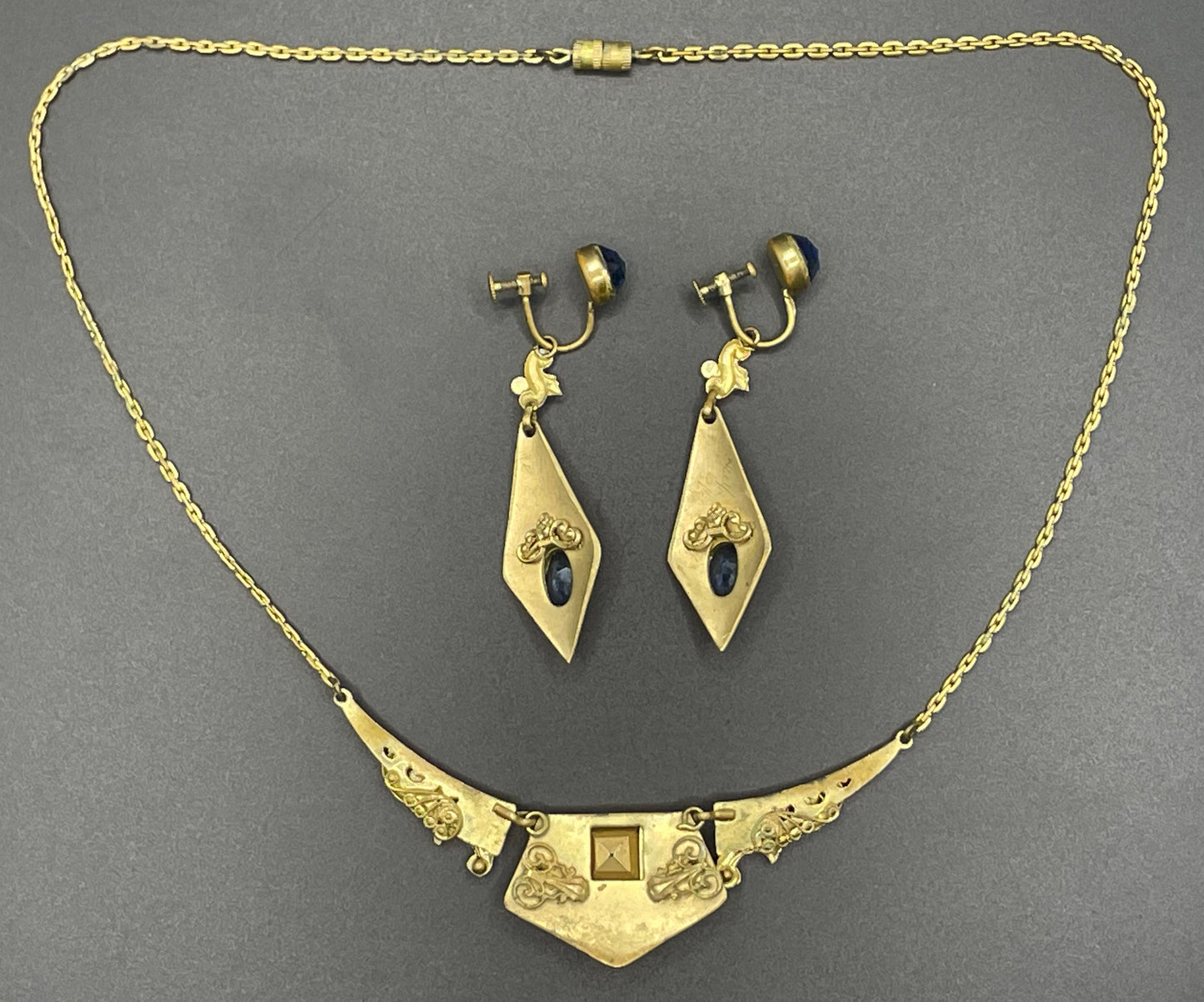 Vintage Neiger brothers sapphire blue rhinestone ornate Art Deco necklace and screw back earrings set in gold tone