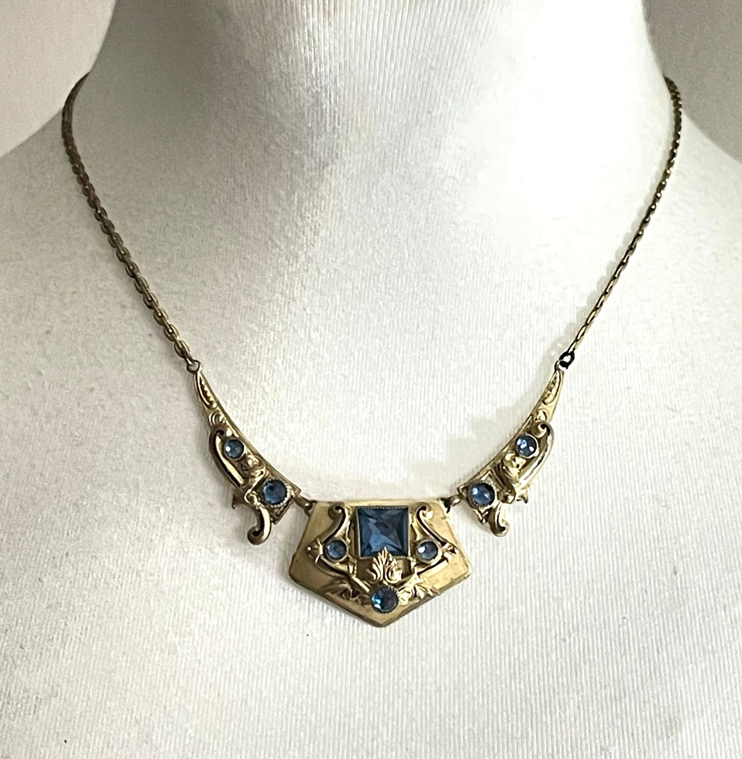 Vintage Neiger brothers sapphire blue rhinestone ornate Art Deco necklace and screw back earrings set in gold tone