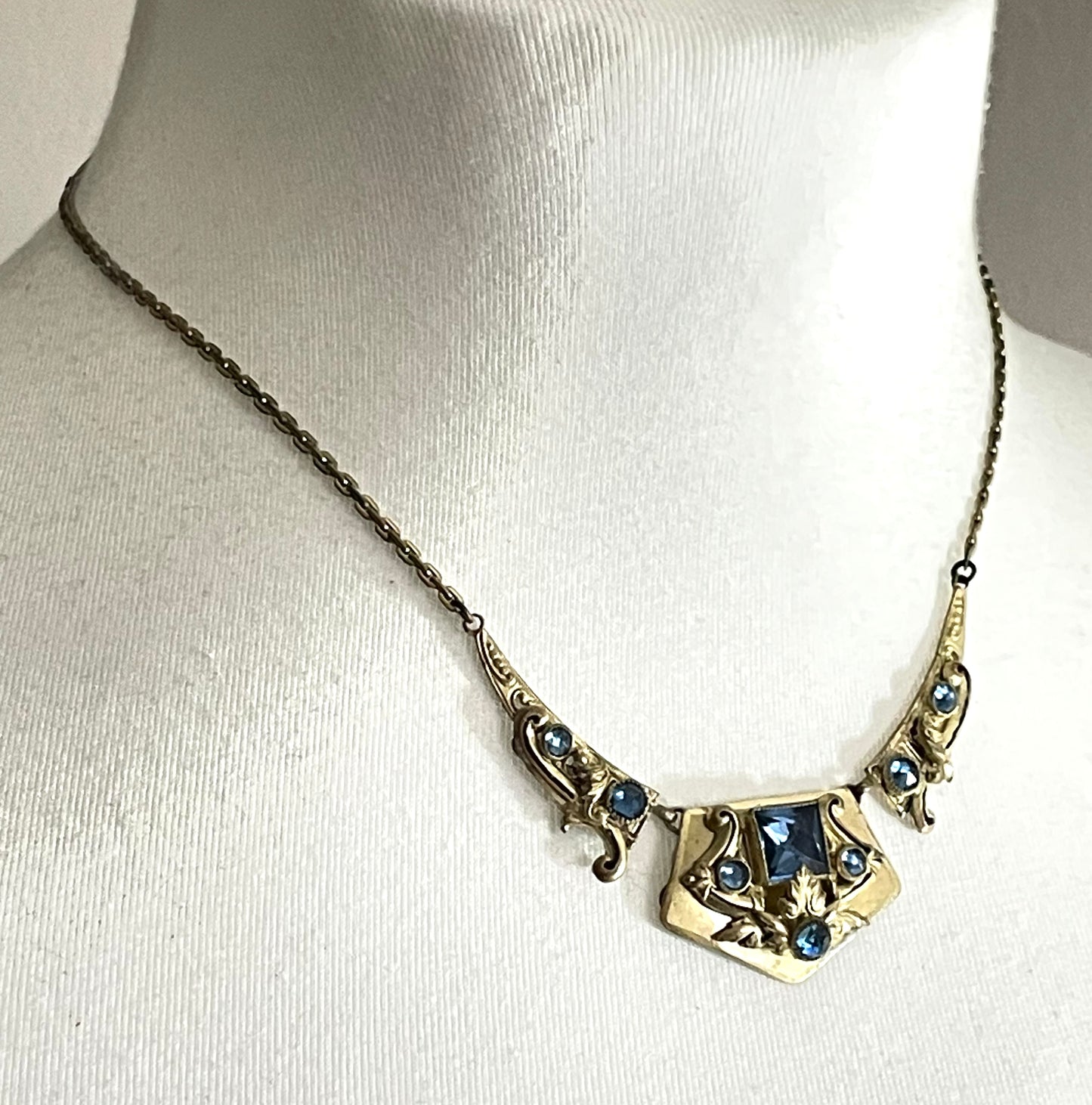 Vintage Neiger brothers sapphire blue rhinestone ornate Art Deco necklace and screw back earrings set in gold tone