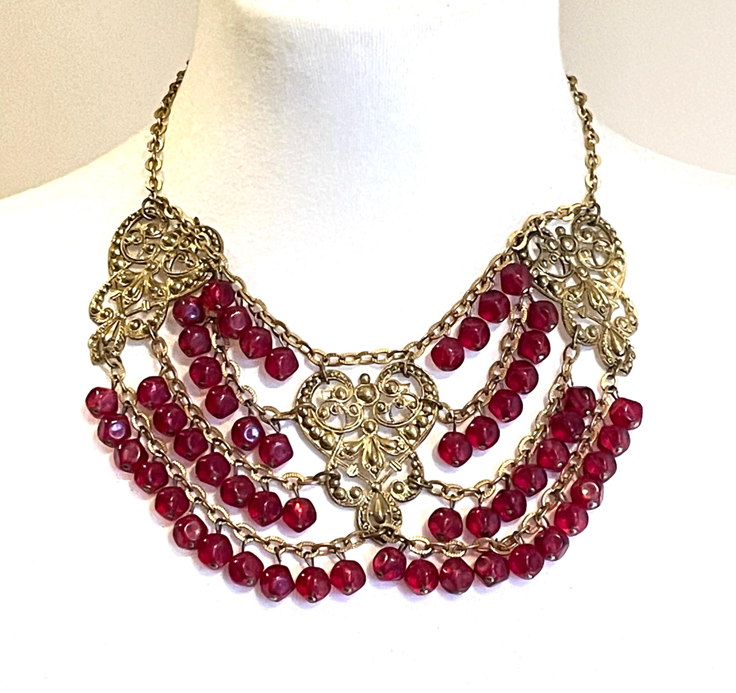 Vintage ruby red poured glass beaded festoon fringe necklace with gold tone filigree panels, French or Czech or perhaps Miriam Haskell style
