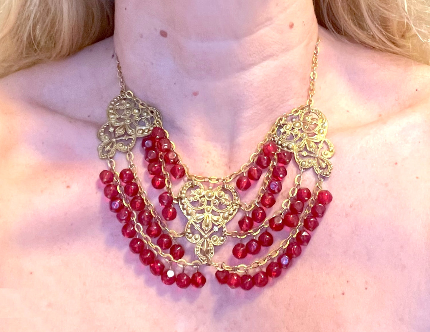 Vintage ruby red poured glass beaded festoon fringe necklace with gold tone filigree panels, French or Czech or perhaps Miriam Haskell style