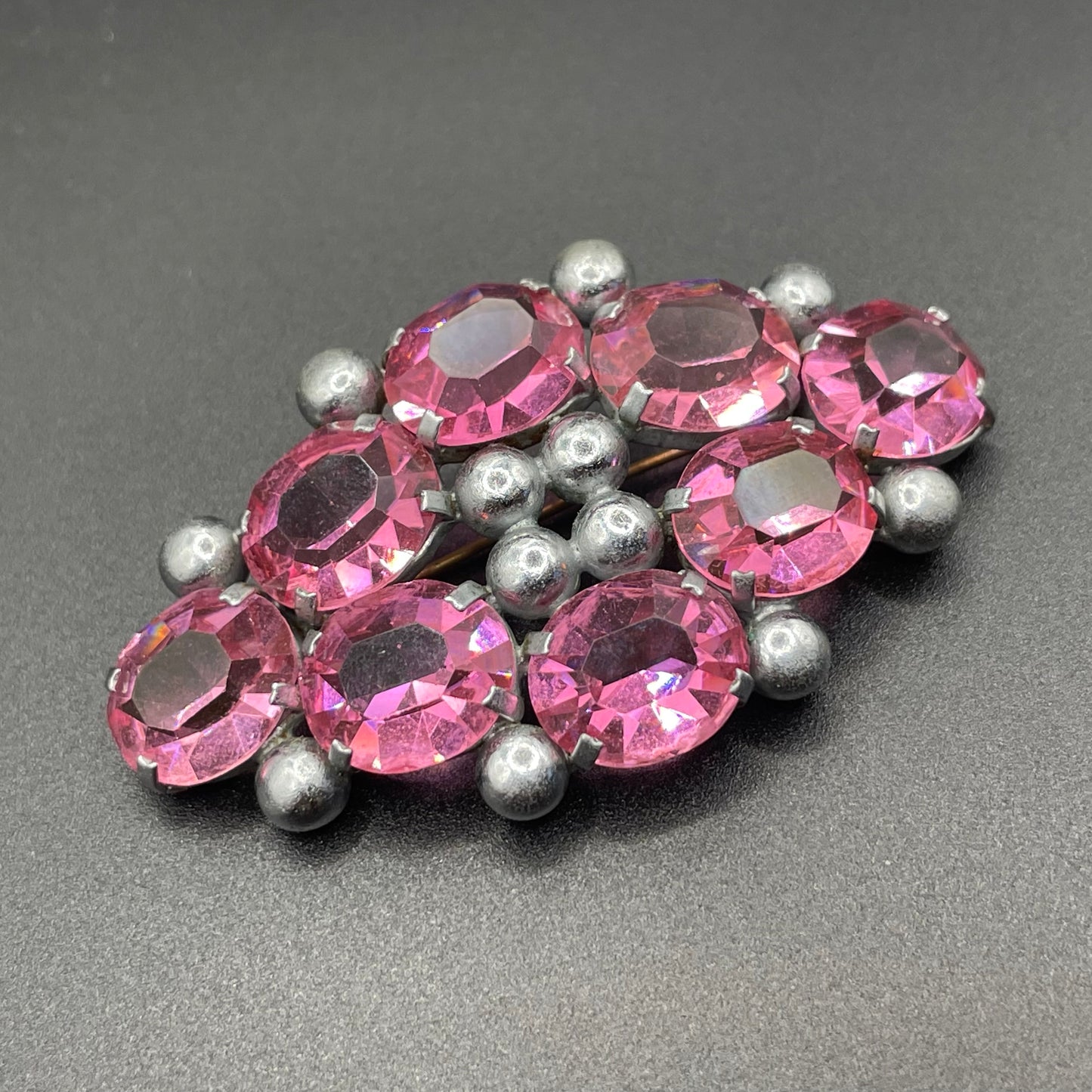 Vintage Art Deco chrome and ruby pink glass open-backed rhinestone brooch pin, machine age