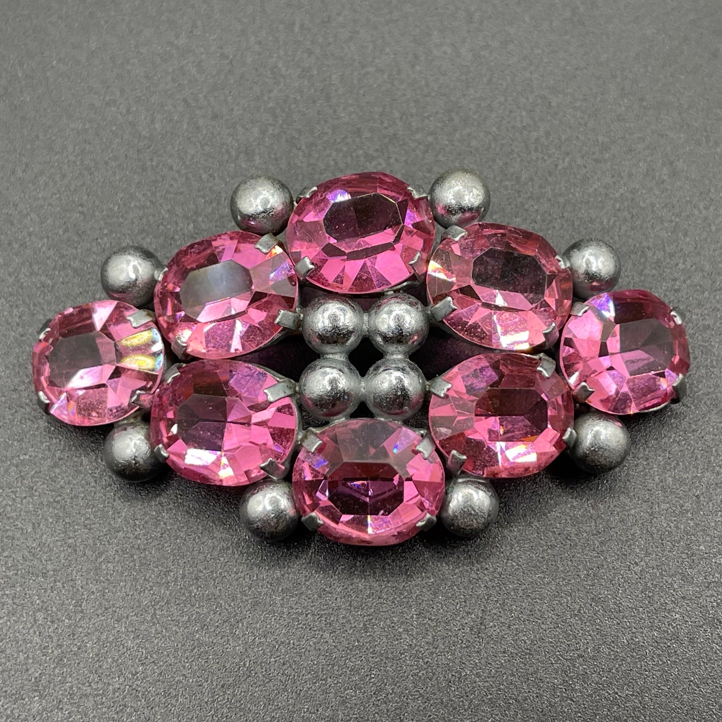 Vintage Art Deco chrome and ruby pink glass open-backed rhinestone brooch pin, machine age