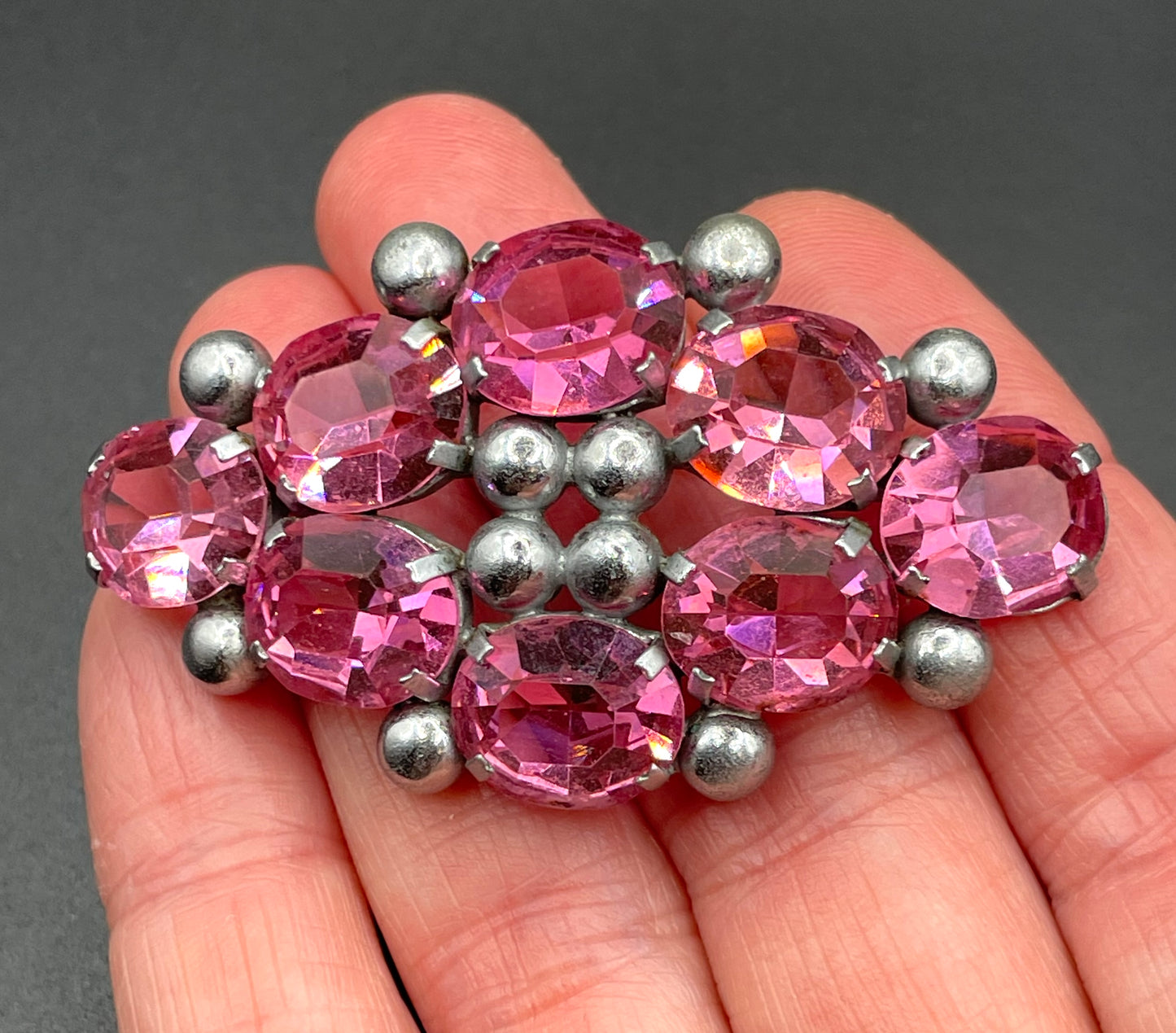 Vintage Art Deco chrome and ruby pink glass open-backed rhinestone brooch pin, machine age