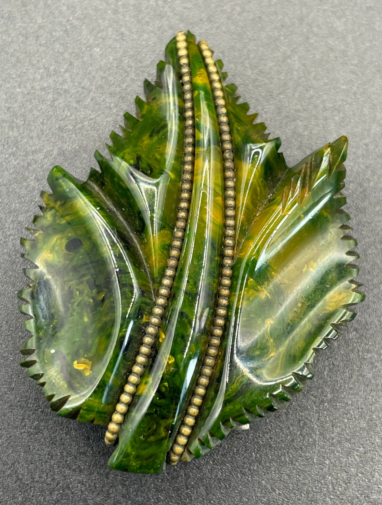 Vintage green marbled Bakelite (verified) and gold tone leaf design dress clip - with slim chain included to double as a pendant