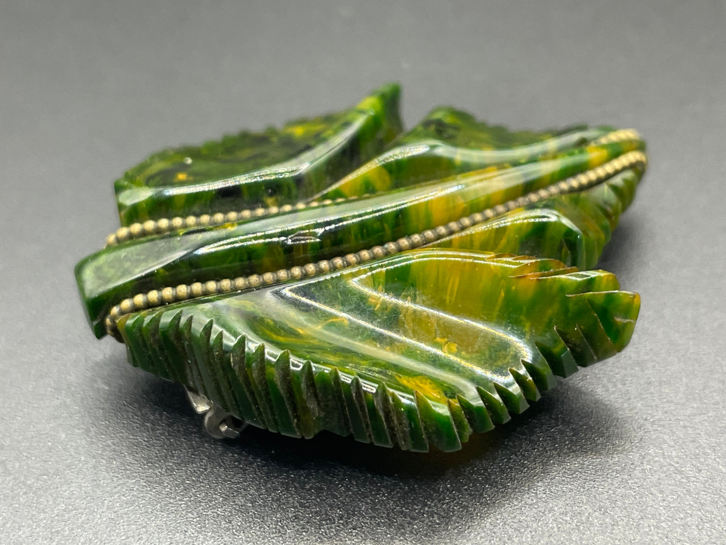 Vintage green marbled Bakelite (verified) and gold tone leaf design dress clip - with slim chain included to double as a pendant