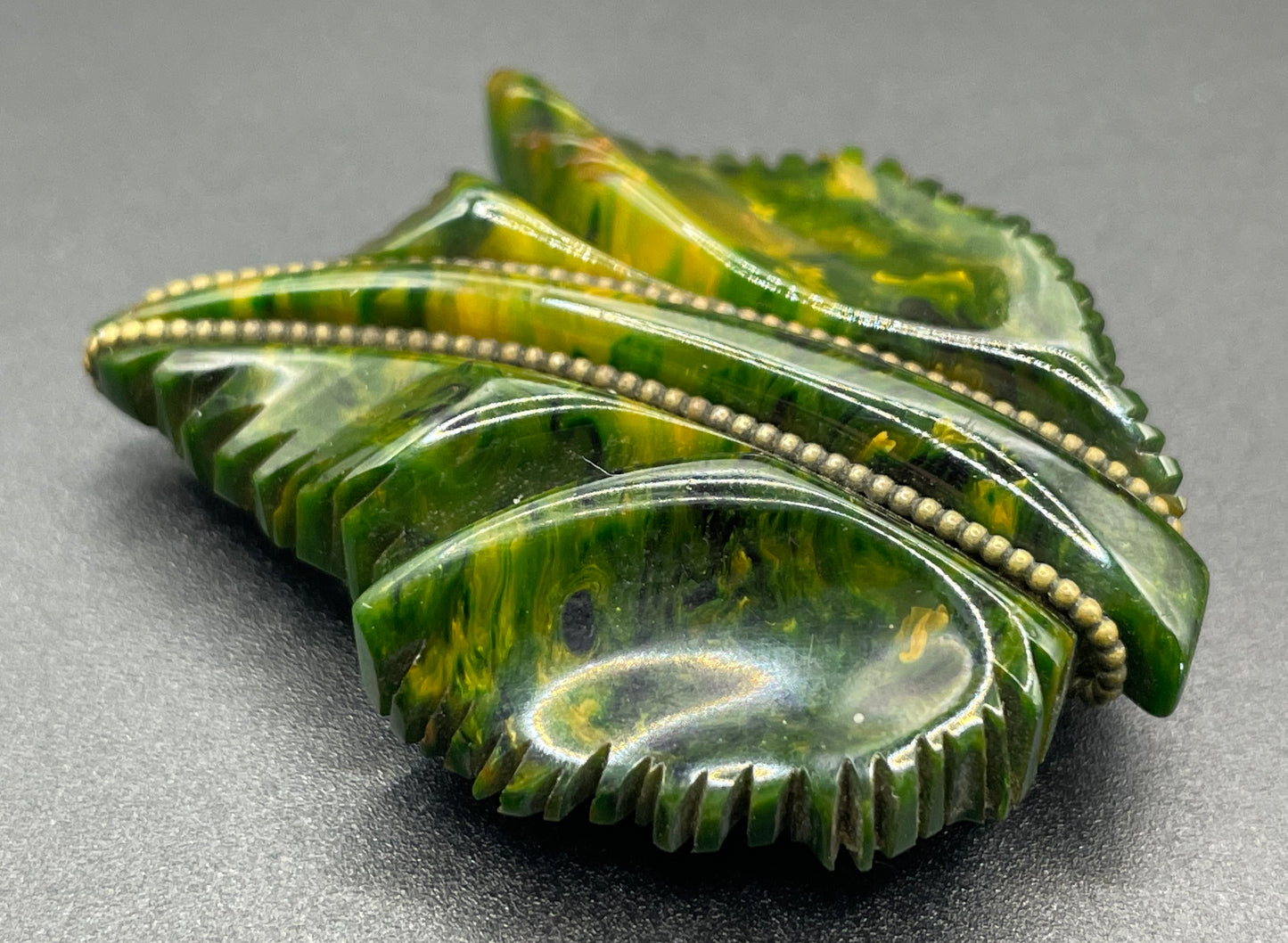 Vintage green marbled Bakelite (verified) and gold tone leaf design dress clip - with slim chain included to double as a pendant