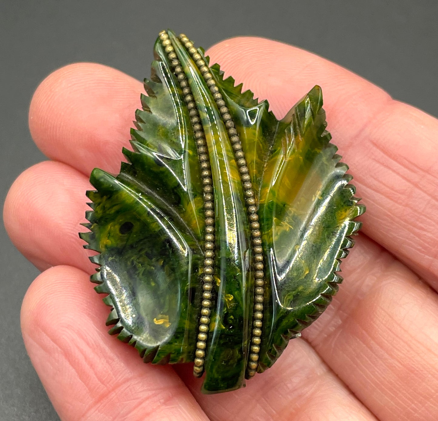 Vintage green marbled Bakelite (verified) and gold tone leaf design dress clip - with slim chain included to double as a pendant