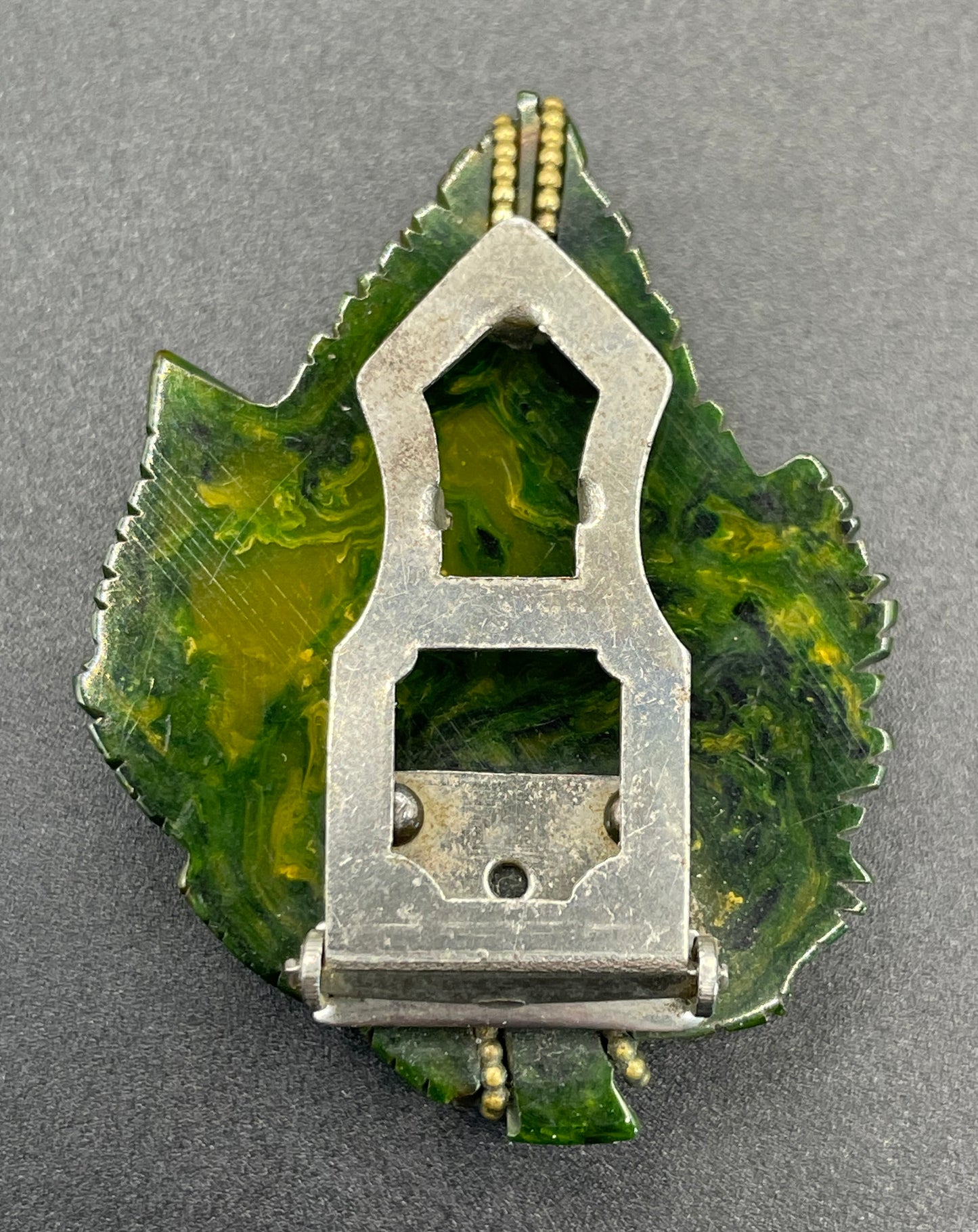 Vintage green marbled Bakelite (verified) and gold tone leaf design dress clip - with slim chain included to double as a pendant