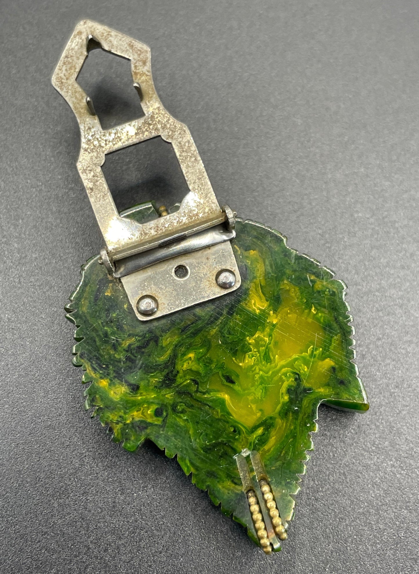 Vintage green marbled Bakelite (verified) and gold tone leaf design dress clip - with slim chain included to double as a pendant