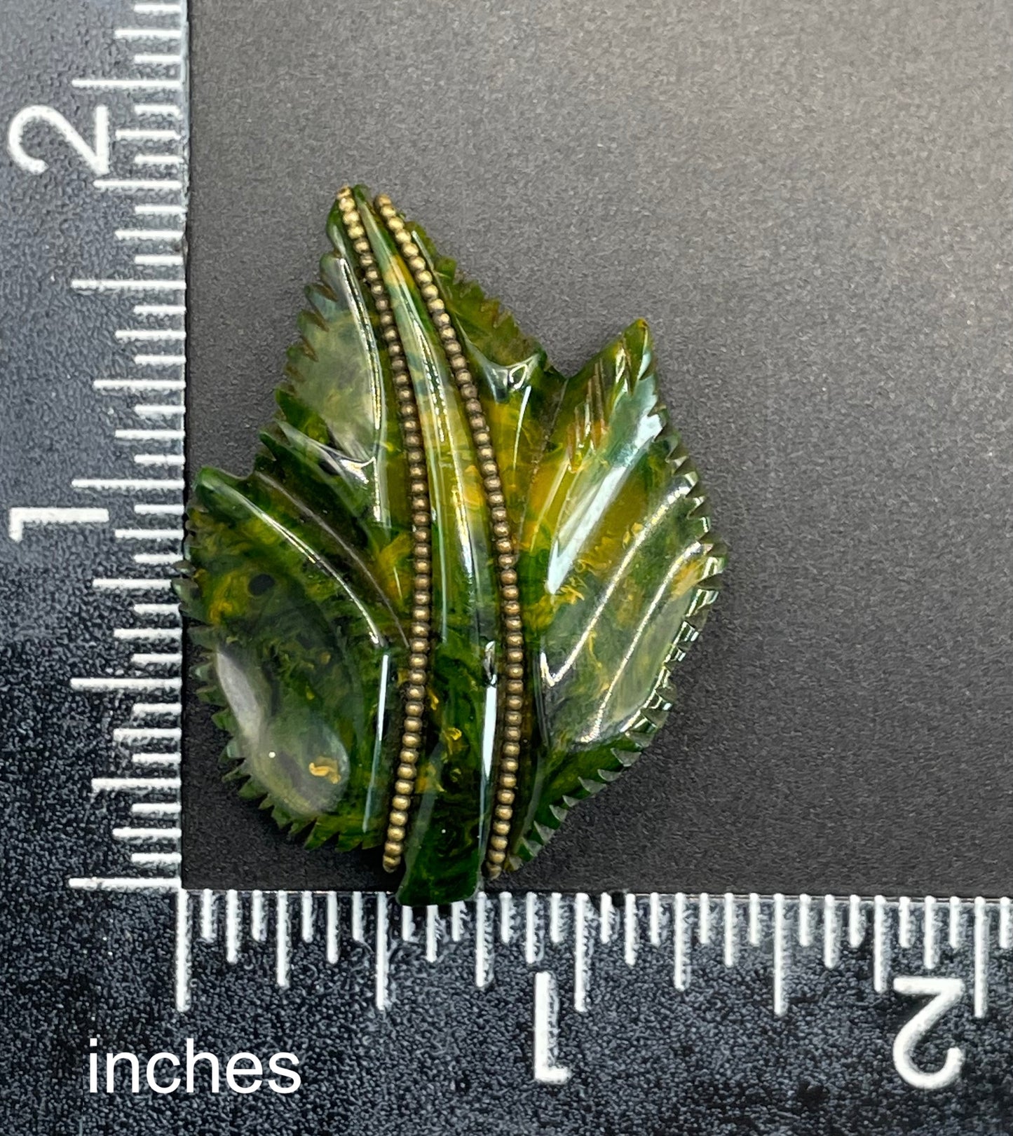 Vintage green marbled Bakelite (verified) and gold tone leaf design dress clip - with slim chain included to double as a pendant