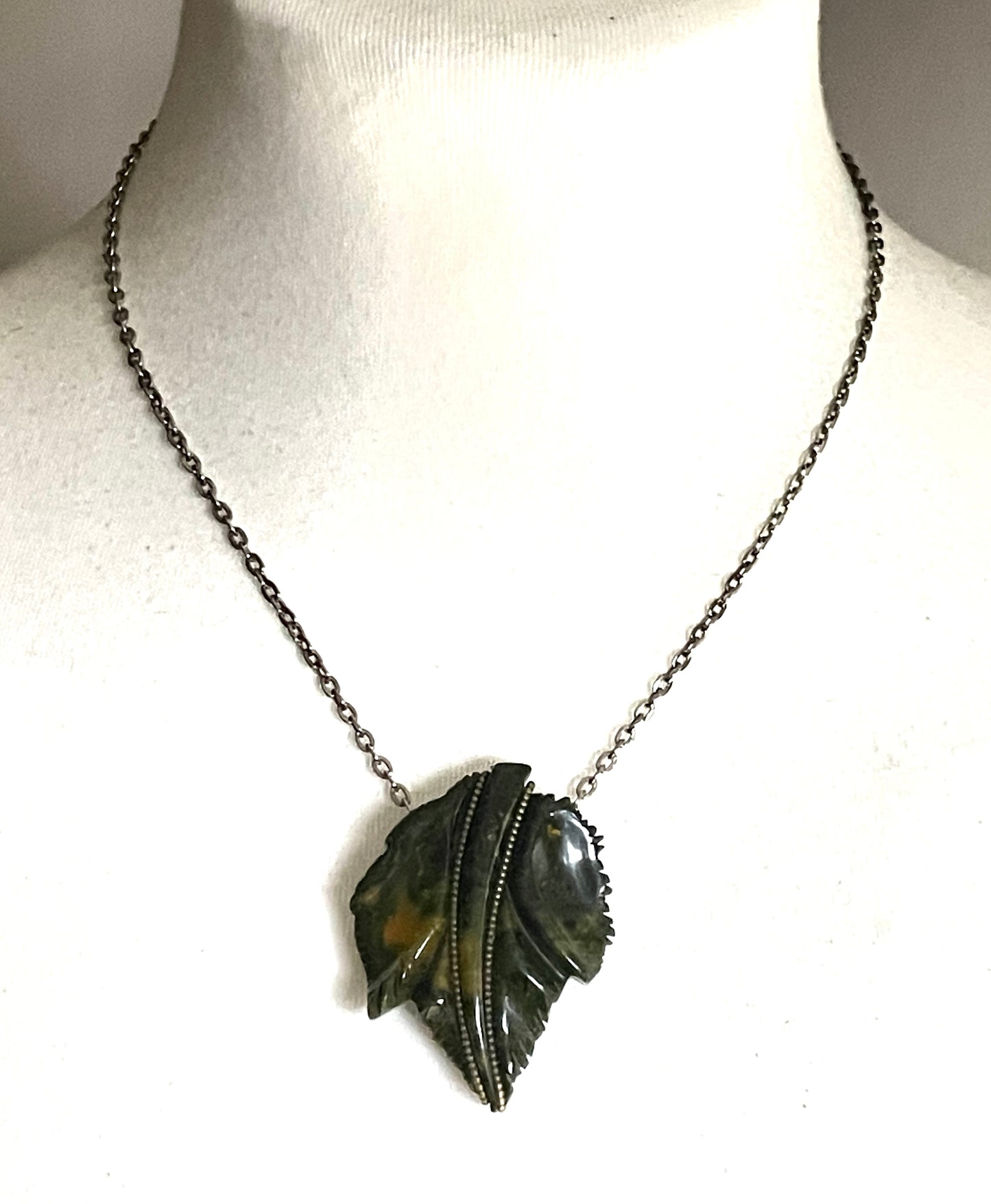 Vintage green marbled Bakelite (verified) and gold tone leaf design dress clip - with slim chain included to double as a pendant