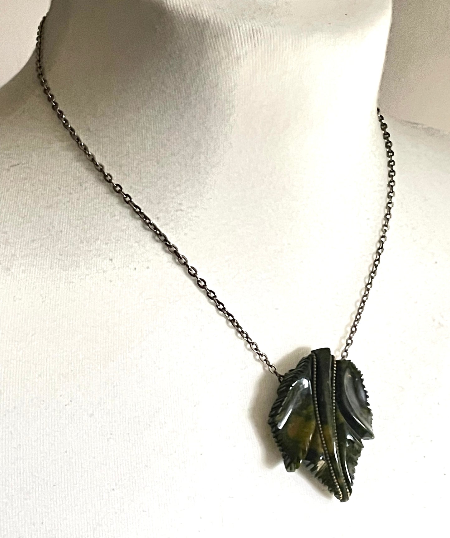Vintage green marbled Bakelite (verified) and gold tone leaf design dress clip - with slim chain included to double as a pendant