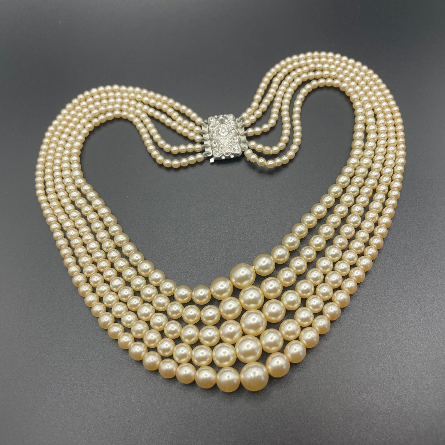 Vintage five strand glass faux pearl necklace with ornate clear rhinestone box clasp, graduated glass pearls