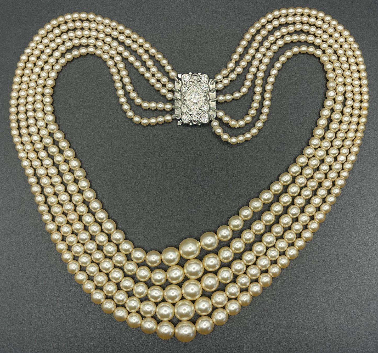 Vintage five strand glass faux pearl necklace with ornate clear rhinestone box clasp, graduated glass pearls