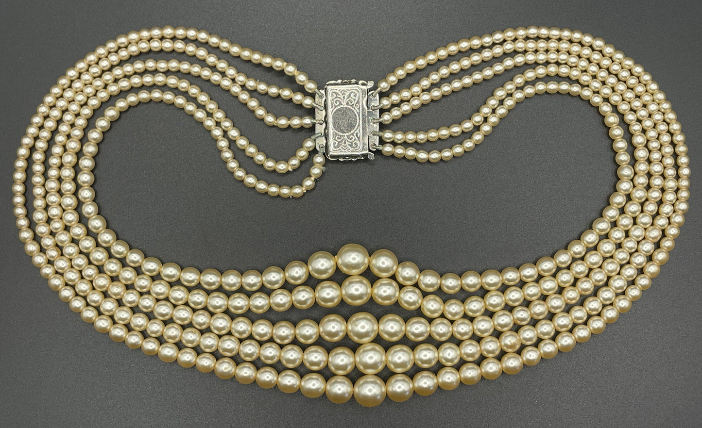 Vintage five strand glass faux pearl necklace with ornate clear rhinestone box clasp, graduated glass pearls