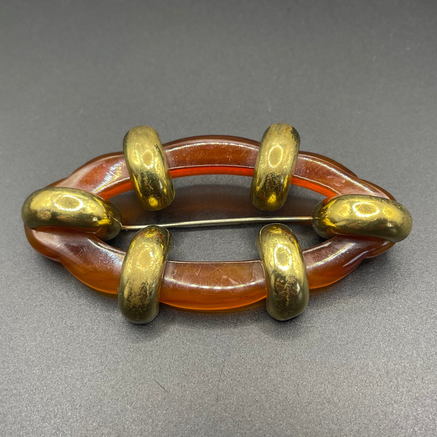 Large vintage rootbeer Bakelite (verified) and gold tone Art Deco machine age geometric brooch, classic 1930s design