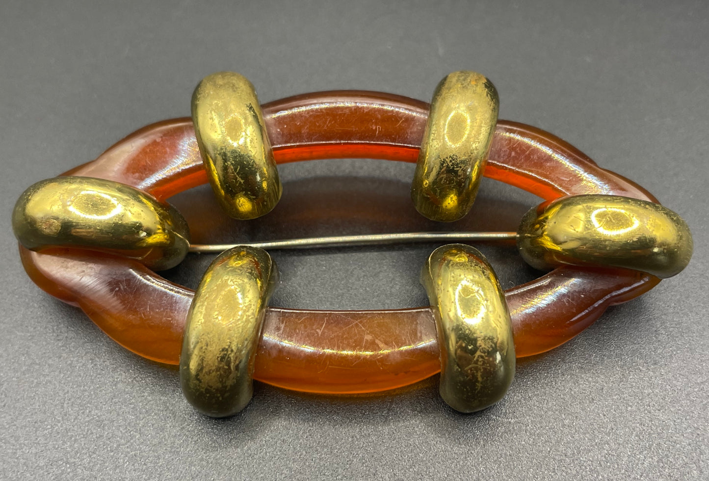 Large vintage rootbeer Bakelite (verified) and gold tone Art Deco machine age geometric brooch, classic 1930s design