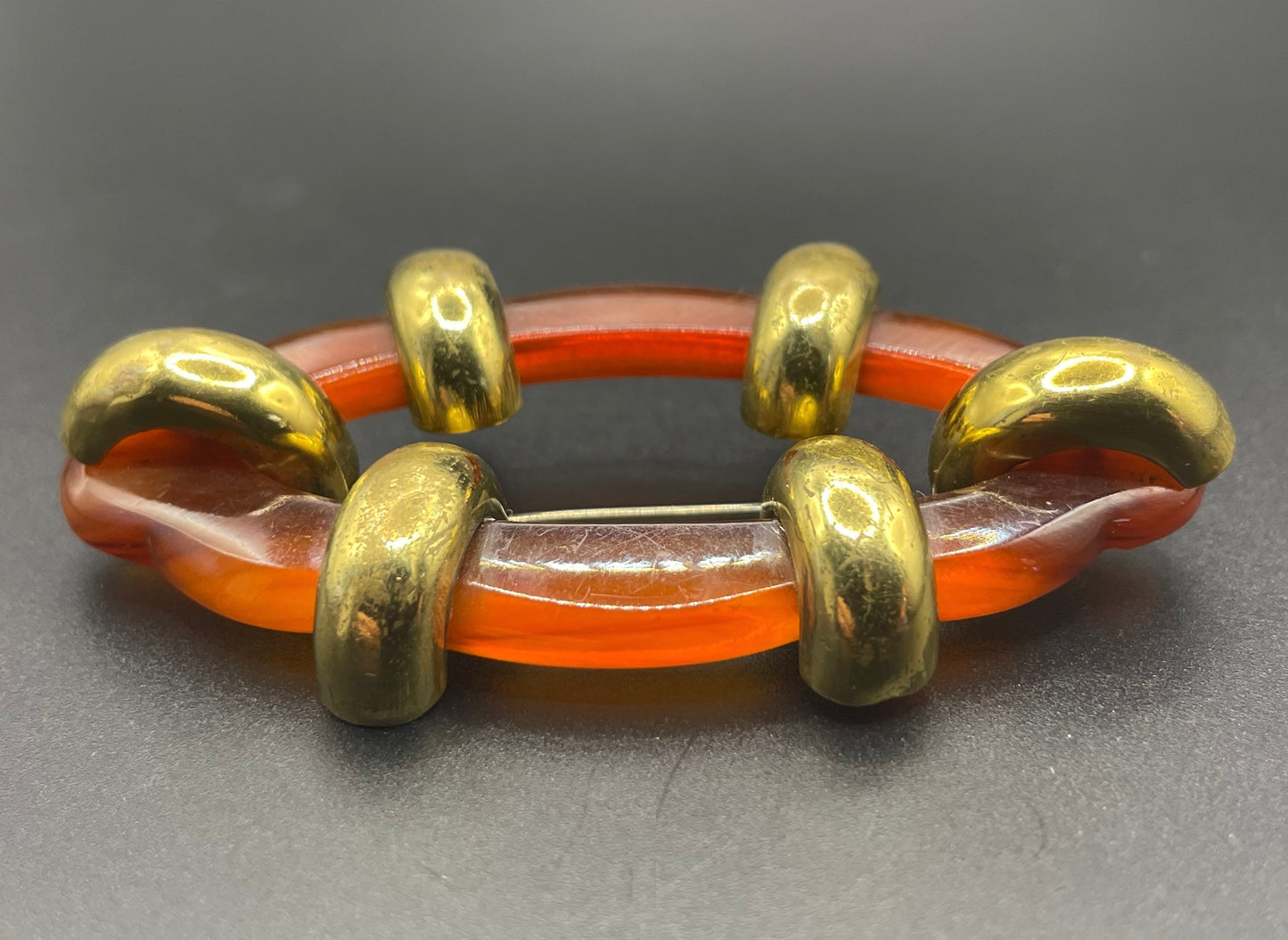 Large vintage rootbeer Bakelite (verified) and gold tone Art Deco machine age geometric brooch, classic 1930s design