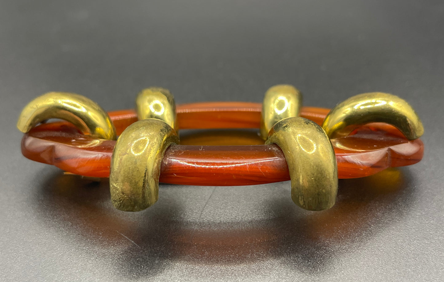 Large vintage rootbeer Bakelite (verified) and gold tone Art Deco machine age geometric brooch, classic 1930s design