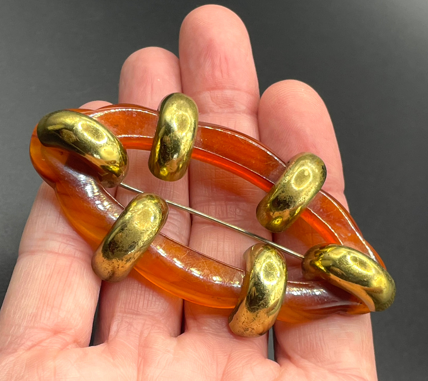 Large vintage rootbeer Bakelite (verified) and gold tone Art Deco machine age geometric brooch, classic 1930s design