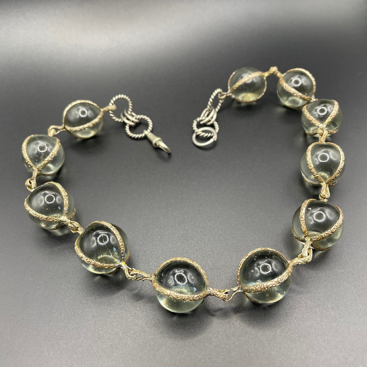 Unusual antique 'pools of light' STYLE choker necklace with undrilled GLASS orbs in ornate, but rustic silver tone settings with subtle gilt