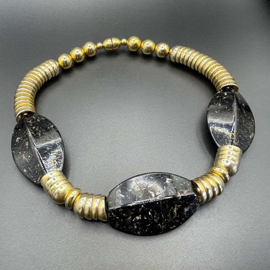 Vintage Jakob Bengel Art Deco 1930s machine age collar necklace with gold tone stacked cup beads and huge black, sparkly galalith beads