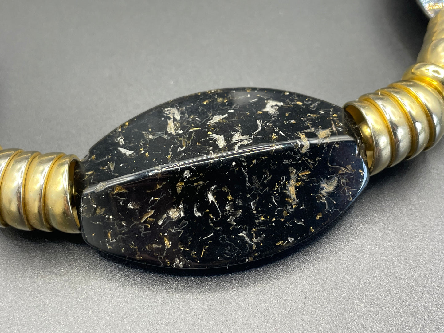 Vintage Jakob Bengel Art Deco 1930s machine age collar necklace with gold tone stacked cup beads and huge black, sparkly galalith beads